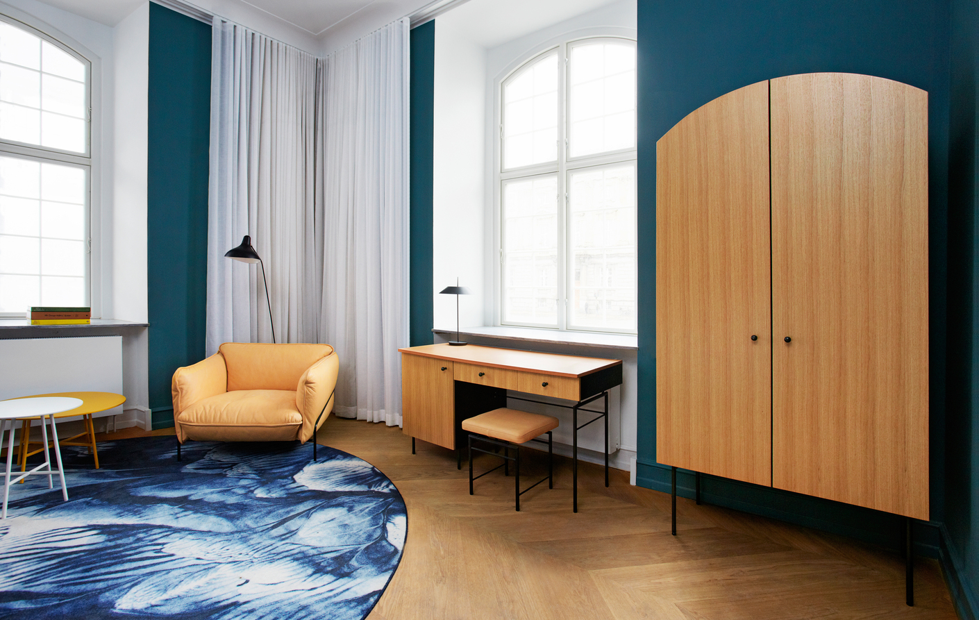 The solid wood furniture grounds the atmosphere in the room.