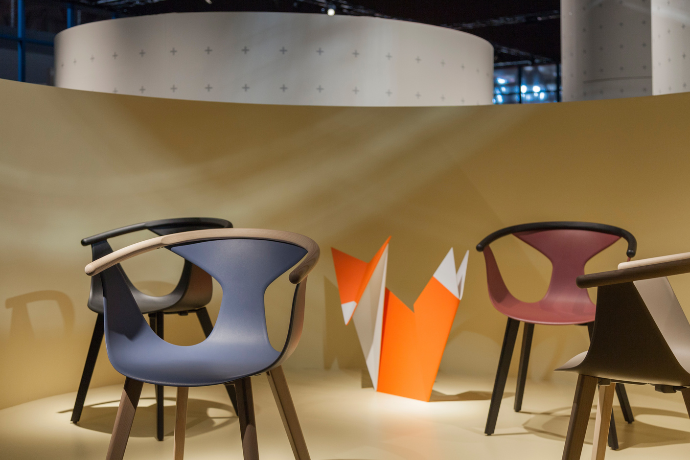 "Fox" by Pedrali is stackable and surprised with an elegant shape and a material mix of plastic and ash wood.