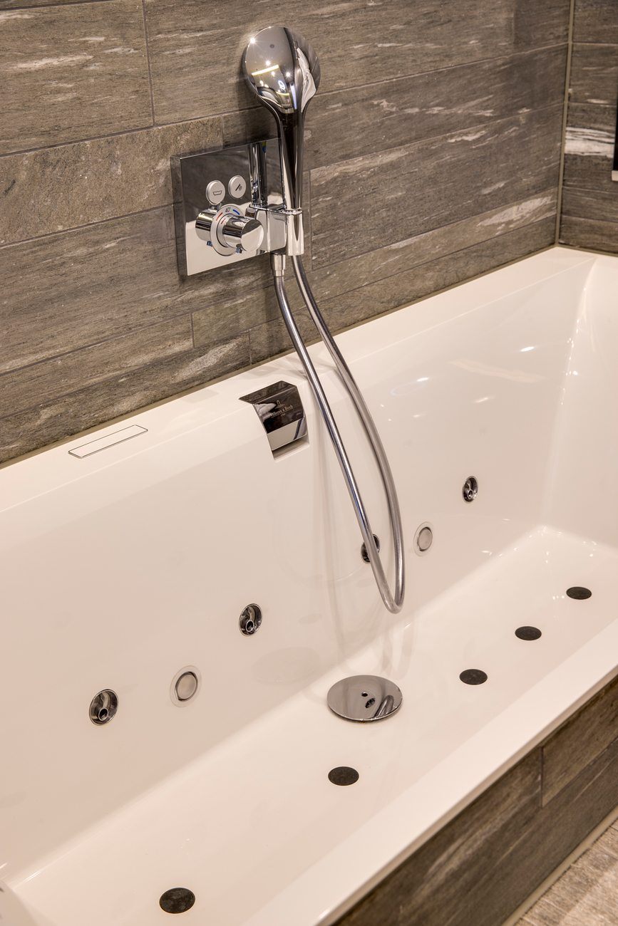 The tubs are made of "Quaryl", a composite of natural quartz stone and acrylic resin.