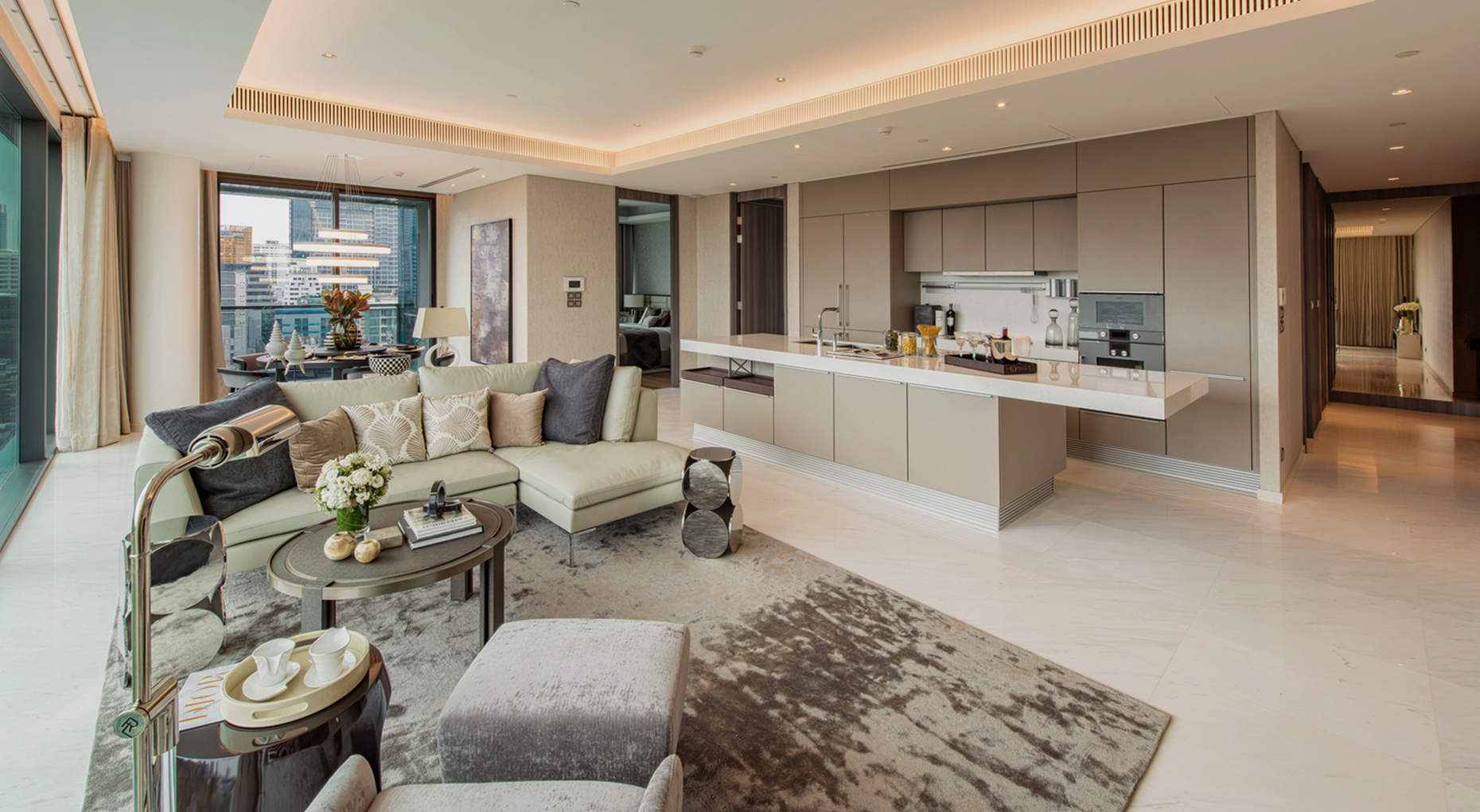 The spacious living rooms in the new Sindhorn Tonson luxury complex leave plenty of room for hospitality with an open cooking area.