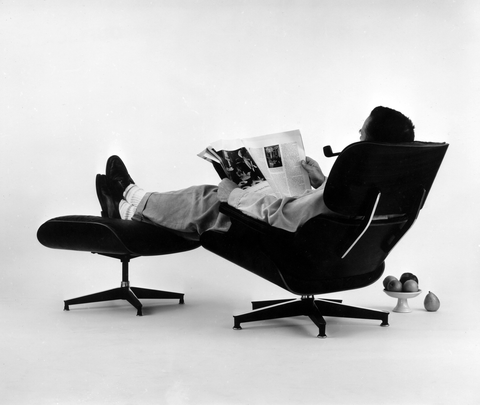 Vitra Design Museum An Eames Celebration  Charles Eames In The Plywood Lounge And Ottoman 1956
