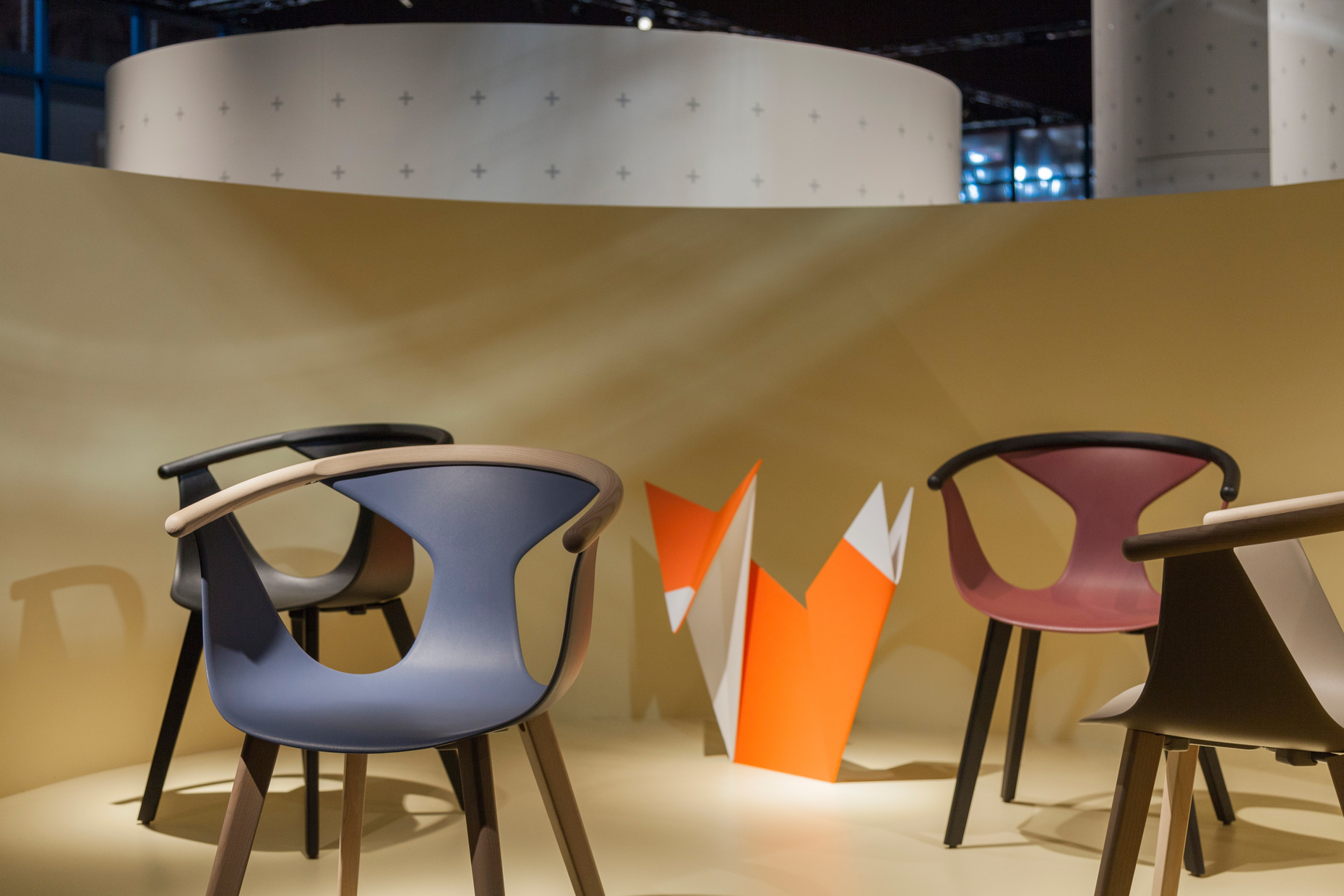 "Fox" by Pedrali is stackable and surprised with an elegant shape and a material mix of plastic and ash wood.