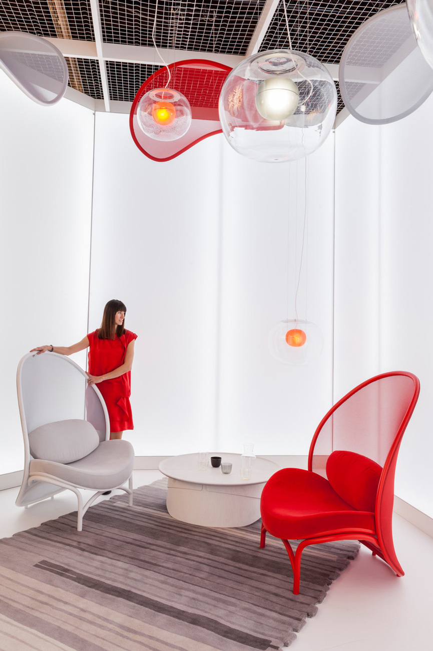 The solid seat area forms a contrast to the perforated backrest.