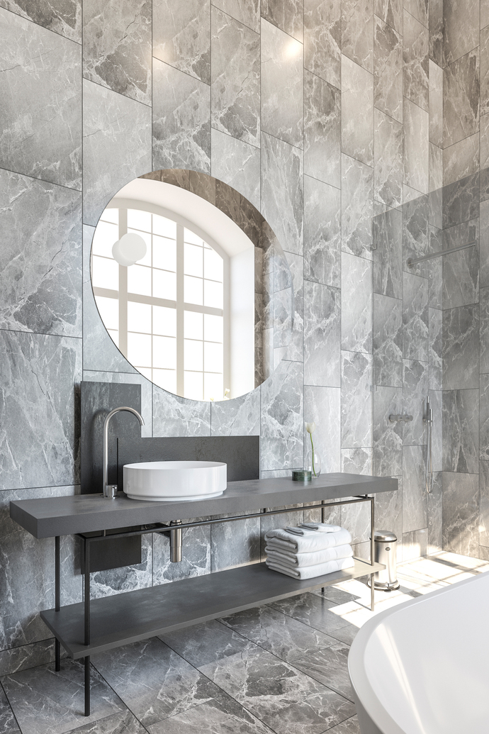 In the bathrooms, minimalist furniture complement the marble slabs.