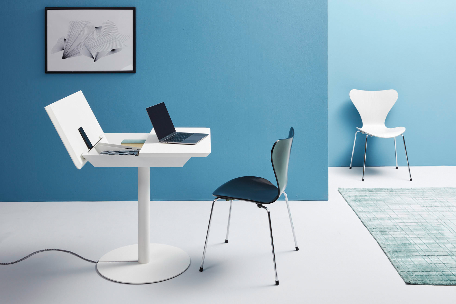 The right table for the Micro Apartment: Thanks to a large storage compartment and cable management, the small "Duotable" is as good a desk as it is a dining table.