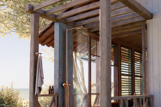 AXOR Starck Nature shower column | Brushed Bronze  by  AXOR
